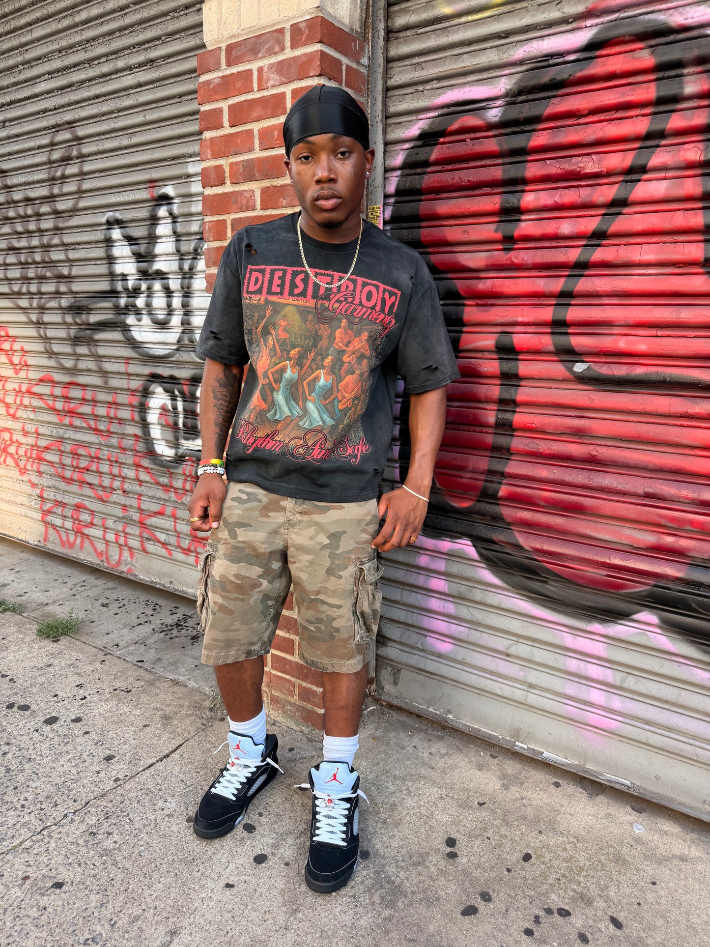 "RHYTHM AIN'T SAFE" TEE